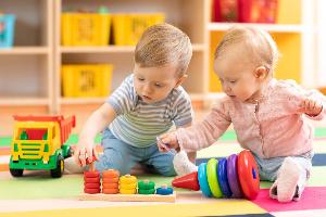 Two toddlers playing at nursery