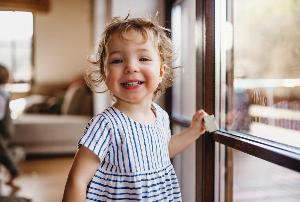 A preschool child smiling at nursery